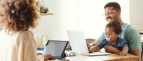 A family at a table reviewing digital solutions