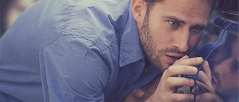 Man meticulously inspecting his vehicle prior to his lease-end inspection